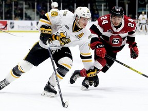 Sarnia Sting's Jamieson Rees (39) drives to the 67's net ahead of Ottawa's Joseph Garreffa (24) in the first period at Progressive Auto Sales Arena in Sarnia, Ont., on Sunday, Nov. 17, 2019. Mark Malone/Chatham Daily News/Postmedia Network