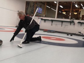 Tod Wilfong came out to "Try Curling" after taking a break for a few years, behind him is volunteer Louella Ryder, whose husband also came out to try curling for the first time. She hopes that he enjoyed his evening and that he sticks with the sport that she loves so much. Hannah MacLeod/Kincardine News