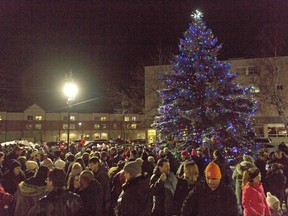 The crowd looks at the recently lit Christmas tree at the 30th-anniversary Ol Fashioned Christmas Walk in Downtown North Bay in 2018. The annual event resumes this year.