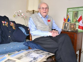 In this 2019 Sun Times photo, Second World War veteran Charlie Fisher sits in the living room of his Owen Sound home, next to photographs, medals and other items linked to his time in the war.
Denis Langlois/The Owen Sound Sun Times/Post Media Network