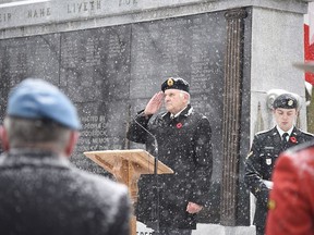 Ron Findlater, the service's master of ceremonies, salutes during Woodstock's Remembrance Day ceremony in 2019. (Kathleen Saylors/Woodstock Sentinel-Review)