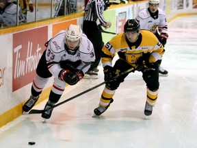 Brady Lyle (left) races Shane Wright to the puck in the second period as the Owen Sound Attack host the Kingston Frontenacs inside the Harry Lumley Bayshore Community Centre Saturday, Nov. 19, 2019. Greg Cowan/The Sun Times