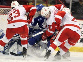 Sudbury Wolves goalie Mitchell Weeks and Shane Bulitka defend against Soo Greyhounds Rory Kerins, Joe Carroll and Cole MacKay during third-period Ontario Hockey League action at GFL Memorial Gardens on Saturday, Dec. 28, 2019 in Sault Ste. Marie, Ont. (BRIAN KELLY/THE SAULT STAR/POSTMEDIA NETWORK)