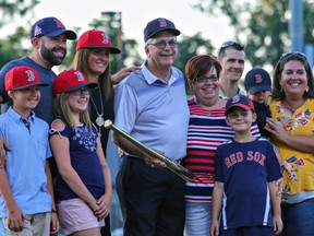 Jamie Corke (centre),  a former Brantford Red Sox player and longtime umpire who passed away Dec. 6, is surrounded by his family in this photo when he was recognized by the Red Sox for his inclusion on the Intercounty Baseball League's list of its top-100 players. Photo courtesy Crystal Young Photography