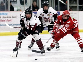Chatham Maroons' Ryan McKim (7) is chased by Leamington Flyers' Cameron Blanton (13) in the third period at Chatham Memorial Arena in Chatham, Ont., on Sunday, Dec. 8, 2019. Mark Malone/Chatham Daily News/Postmedia Network