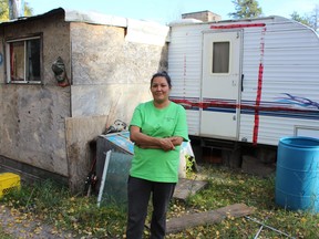 Nicole Adby stands outside an addition to her mobile home, which sits on her mother's property in Conklin, Alta. on Sunday, September 22, 2019. Vincent McDermott/Fort McMurray Today/Postmedia Network