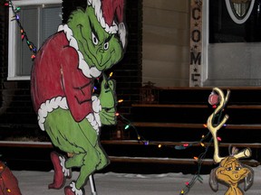 The Grinch and his faithful furry friend Max attempt to steal Christmas at a residence in Stony Plain Friday, Dec. 20, 2019. The Town recently announced details of its Winter Light Up programming which is modified this year due to COVID-19.