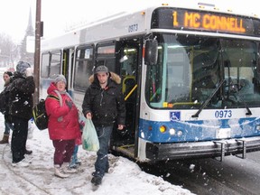 Passengers getting on and off Cornwall Transit, on a snowy day in downtown Cornwall, Wednesday,  Feb. 4, 2015.