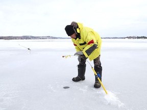 Rolly Rousseau took advantage of the mild temperatures and tried his luck ice fishing on Ramsey Lake in Sudbury, Ont. on Friday December 27, 2019.