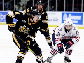 Sarnia Sting's Sam Bitten (41) tries to get away from Oshawa Generals' Ryan Stepien (16) in the first period at Progressive Auto Sales Arena in Sarnia, Ont., on Friday, Jan. 10, 2020. Mark Malone/Chatham Daily News/Sarnia Observer