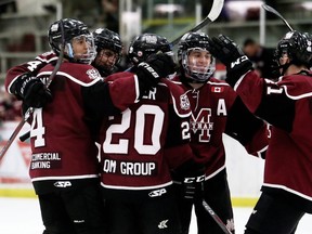 Chatham Maroons' Alan Yu, left, Carson Noble, Brett Fisher, Kyle Fisher and A.J. Ryan celebrate a third-period goal against the Strathroy Rockets at Chatham Memorial Arena in Chatham, Ont., on Sunday, Jan. 12, 2020. Mark Malone/Chatham Daily News/Postmedia Network