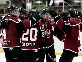 Chatham Maroons' Alan Yu, left, Carson Noble, Brett Fisher, Kyle Fisher and A.J. Ryan celebrate a third-period goal against the Strathroy Rockets at Chatham Memorial Arena in Chatham, Ont., on Sunday, Jan. 12, 2020. Mark Malone/Chatham Daily News/Postmedia Network