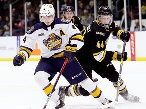 Erie Otters' Jamie Drysdale (4) is chased by Sarnia Sting's Jacob Perreault (44) in the first period at Progressive Auto Sales Arena in Sarnia, Ont., on Friday, Jan. 17, 2020. Mark Malone/Chatham Daily News/Postmedia Network