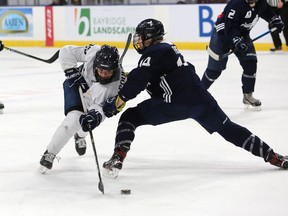 Marie-Philip Poulin, of Team Lacasse, is blocked by Renata Fast from Team Hefford during the Professional Women's Hockey Players Association (PWHPA) game at the Leon's Centre on Saturday, Jan. 4, 2020. Meghan Balogh/The Whig-Standard/Postmedia Network