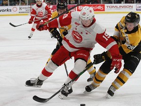 Kingston Frontenacs Ethan Ritchie checks Sault Ste. Marie Greyhounds Joe Carroll during Ontario Hockey League action at the Leon's Centre in Kingston on Friday January 31, 2020.