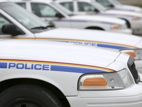 RCMP cruisers line the parking lot at the Airdrie RCMP Detachent on Friday May 15, 2015 in Airdrie, Alta. Britton Ledingham/Airdrie Echo/Postmedia Network ORG XMIT: POS1607142129597267