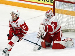 Soo Greyhounds' defenceman Ryan O'Rourke takes a shot in the midsection in front of goalie Nick Malik in OHL action at the Memorial Centre in Peterborough, Ont.