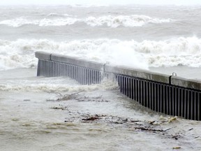 Water washes over a steel groyne in Bright's Grove. (Observer file  photo)