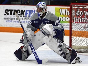 Sudbury Wolves goaltender Mitchell Weeks (70) prepares to make a save during OHL action at Sudbury Community Arena in Sudbury, Ontario on Saturday, January 25, 2019.
