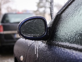 Car frozen side mirror after a freezing rain phenomenon