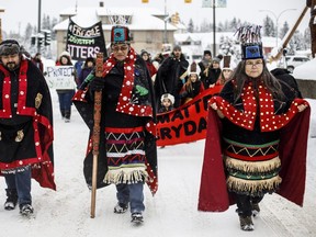 Wet'suwet'en Hereditary Chiefs from left, Rob Alfred, John Ridsdale, centre and Antoinette Austin, who oppose the Costal Gaslink pipeline take part in a rally in Smithers B.C. in 2020.