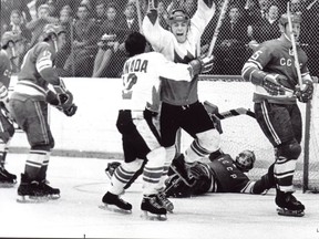 Paul Henderson is embraced by Team Canada teammate Yvan Cournoyer after scoring the winning goal in the 1972 Summit Series.  Postmedia Network