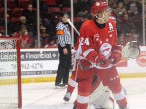 Soo Greyhounds winger Cole MacKay and Ottawa 67s goaltender Cedrick Andree (behind) watch the play during first-period OHL action Friday, Feb. 21, 2020 at GFL Memorial Gardens in Sault Ste. Marie, Ont. JEFFREY OUGLER/THE SAULT STAR/POSTMEDIA NETWORK