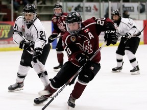 Chatham Maroons' Brett Fisher (20) skates away from Komoka Kings' Will Lewis (21) in the third period at Chatham Memorial Arena in Chatham, Ont., on Thursday, Feb. 6, 2020. Mark Malone/Chatham Daily News/Postmedia Network