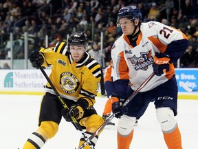 Sarnia Sting's Brayden Guy (14) and Flint Firebirds' Owen Lalonde (21) jockey for position in front of the Firebirds' net in the first period at Progressive Auto Sales Arena in Sarnia, Ont., on Monday, Feb. 17, 2020. Mark Malone/Chatham Daily News/Postmedia Network