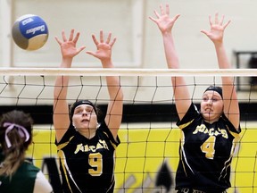 Blenheim Bobcats' Emma Park (4) and Kristyn Kistulinec (9) try for a block against the Lajeunesse Royal during the SWOSSAA 'A' senior girls' volleyball final at Blenheim District High School in Blenheim, Ont., on Tuesday, Feb. 25, 2020. Mark Malone/Chatham Daily News/Postmedia Network