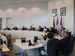 The council for the Regional Municipality of Wood Buffalo conduct their first meeting in-person on May 11, 2016 since wildfires forced 88,000 residents from the region last week. The meeting was held at Edmonton's city hall. Robert Murray/Fort McMurray Today/Postmedia Network