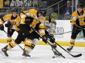 Kingston Frontenacs Vitali Pinchuk and North Bay Battalion James Mayotte fight for the puck as Frontenacs Dustin Hutton (18) and Lucas Rowe (11)  look on during Ontario Hockey League action at the Leon's Centre in Kingston on Friday February 7, 2020. Ian MacAlpine/Kingston Whig-Standard/ Postmedia Network