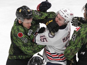 Kingston Frontenacs' Dawson Baker and Oshawa Generals' Kyle MacLean shove prior to fighting during Ontario Hockey League action at the Leon's Centre in Kingston in February 2020. (Ian MacAlpine/The Whig-Standard)
