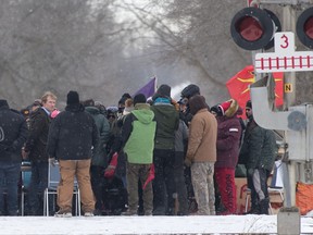 Indigenous Services Minister Marc Miller looks back during a meeting with protesters at a rail blockade on the tenth day of demonstration in Tyendinaga, near Belleville, Ont., Saturday, Feb. 15, 2020. The protest is in solidarity with the Wet'suwet'en hereditary chiefs opposed to the LNG pipeline in northern British Columbia. THE CANADIAN PRESS/Lars Hagberg