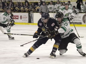 Spruce Grove Saints forward Seth Fyten battles with Drayton Valley Thunder defenceman Brett Bamber during a 3-2 shootout win for Spruce Grove in Alberta Junior Hockey League action on Tuesday, Oct. 21, 2019.