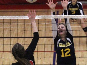 St. Mike's Mikayla Groenestege tries to block Woodstock Collegiate's Autumn LaRonde during the WOSSAA double-A junior girls' final Wednesday in Woodstock. WCI won in four sets. Cory Smith