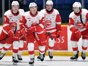Soo Greyhounds (from left) Joe Carroll, Rory Kerins, Jacob Holmes and Billy Constantinou, celebrate a recent goal. The Hounds hope to resume the OHL season and gain a Western Conference playoff spot.
