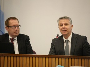 CEO Stephen Thompson, left, and Alex Palimaka, former chairperson of the board of the Sarnia-Lambton Economic Partnership, speak at a Lambton County council meeting about the partnership's recent economic develoment work in the community.