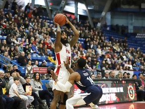JR Holder, of the Sudbury Five, is closely guarded by Antoine Mason, of the Halifax Hurricanes, during basketball action at the Sudbury Community Arena in Sudbury, Ont. on Friday February 7, 2020.