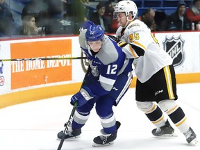 Matej Pekar, left, of the Sudbury Wolves, skates past Justin Nolet, of the Sarnia Sting, during OHL action at the Sudbury Community Arena in Sudbury, Ont. on Friday February 14, 2020.