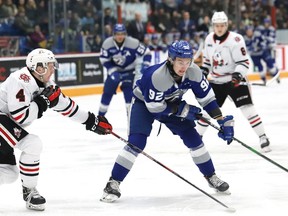 Blake Murray, right, of the Sudbury Wolves, skates around Isaac Enright, of the Niagara IceDogs, during OHL action at the Sudbury Community Arena in Sudbury, Ont. on Friday February 28, 2020. John Lappa/Sudbury Star/Postmedia Network