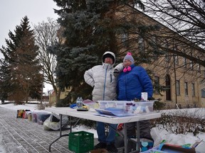 Tim Smith and Joan Schermerhorn, volunteers with Woodstock's community outreach table, braved the cold on Thursday afternoon Feb. 6, 2020. The table, run under the umbrella of Cycles of Life, now operates from the Women's Employment Resource Centre. (Kathleen Saylors/Woodstock Sentinel-Review)