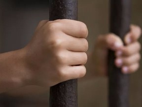 jail hands on bars