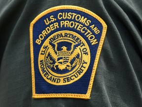 A U.S. Customs and Border Protection patch is seen on the arm of a U.S. Border Patrol agent.
