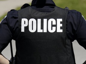 Belleville Police Sgt. Brad Stitt walks past Centennial Secondary School  Friday, June 7, 2019 in Belleville, Ont. Luke Hendry/Belleville Intelligencer/Postmedia Network