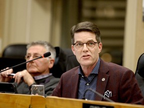 Coun. Matt Wren makes a point during discussion of Brockville's tourism contract, while then economic development, recreation and tourism committee citizen member Tony Barnes listens, during a earlier debate in February 2020. (FILE PHOTO)