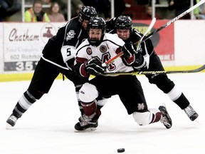 Chatham Maroons' Evan Wells (88) is knocked down by LaSalle Vipers' Derek Berdusco (5) and Matt Carvalho (8) in the third period at Chatham Memorial Arena in Chatham, Ont., on Sunday, March 1, 2020. Mark Malone/Chatham Daily News/Postmedia Network