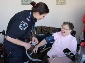 Cornwall-SDG EMS paramedic Tricia Boisuenue takes McConnell Manor resident Marilyn Crawford's blood pressure on Wednesday March 22, 2017 in Cornwall, Ont. Alan S. Hale/Cornwall Standard-Freeholder/Postmedia Network