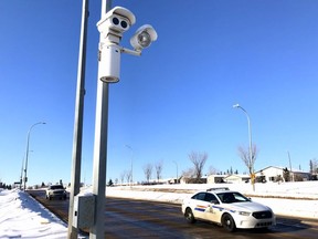 A Wood Buffalo RCMP cruiser drives past a photo radar camera near the corner of Thickwood Boulevard and Silin Forest Road on Thursday, February 21, 2019. Vincent McDermott/Fort McMurray Today/Postmedia Network
