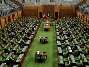 The House of Commons on March 24, 2020 as legislators convene to give the government power to inject billions of dollars in emergency cash during the COVID-19 coronavirus outbreak. Photo by Blair Gable/ Reuters.